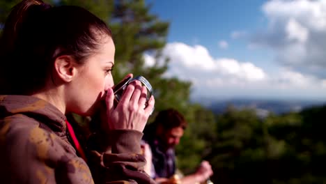 Group-of-hikers-having-a-coffee-break-and-eating-lunch