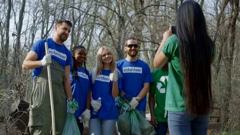 Girl-taking-photo-of-friends-in-volunteerism