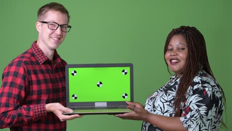 Overweight-African-woman-and-young-Scandinavian-man-together-against-green-background