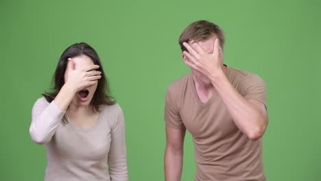 Shocked-young-couple-getting-bad-news-together