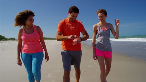 Multi-ethnic-man-and-women-using-sport-watch