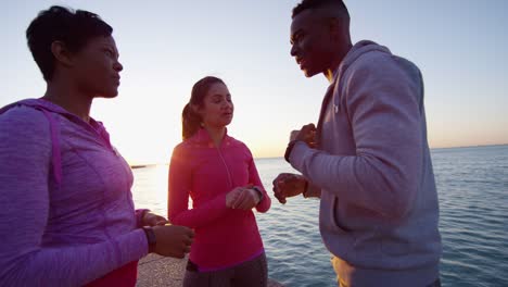 Multi-Ethnic-friends-resting-outdoors-after-fitness-workout