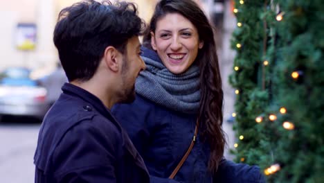 happy-smiling-friends-at-window-shop-in-the-street--Christmas-time