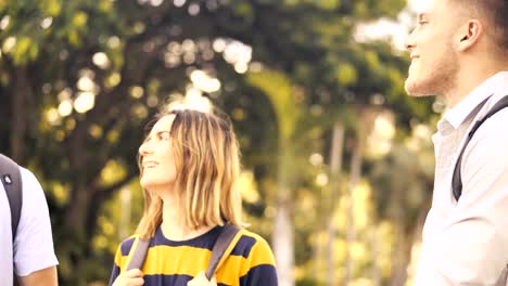 University-students-walking-and-talking-together-outdoor,-slow-motion.