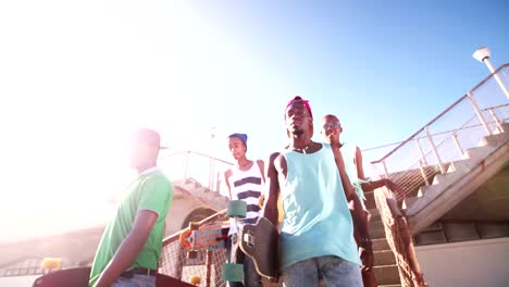 Cool-teen-skater-friends-walking-together-with-clear-sky-overhead