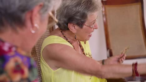 12-Old-Women-Enjoy-Playing-Card-Game-In-Hospice