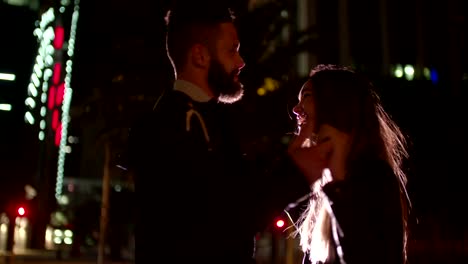 Passionate-young-hipster-couple-dancing-on-evening-in-town