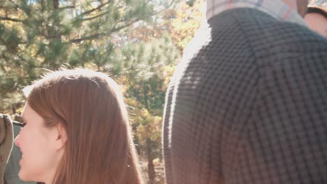 Handheld-close-up-of-friends-talking-outside-at-a-barbecue