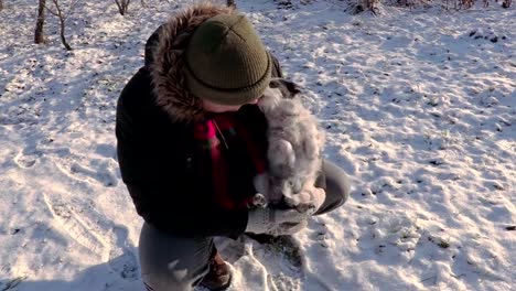 Man-with-small-dog-in-cold-day