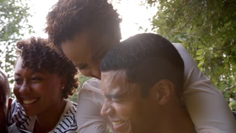 Two-young-adult-black-couples-having-fun-piggybacking