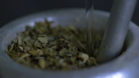 Close-up-macro-of-pouring-hot-water-in-mate