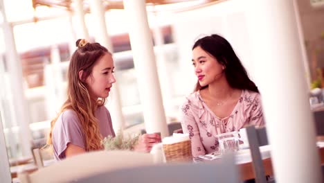 Young-women-enjoying-their-time-together-at-a-traditional-cafe