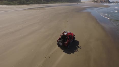 Aerial-shot-of-off-road-vehicle-driving-on-beach