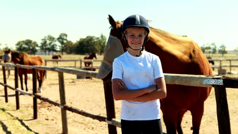 Portrait-of-girl-standing-with-arms-crossed-in-ranch-4k