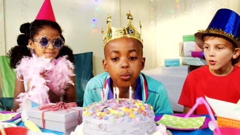 Boy-blowing-candles-on-cake-during-birthday-4k