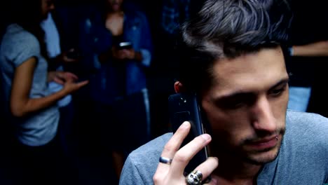 Handsome-young-man-talking-on-the-phone,-4K-4k