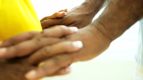 Ethnic-male-and-female-retired-lifestyle-holding-hands