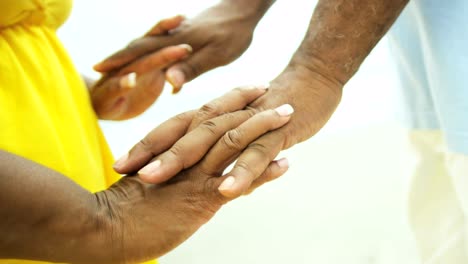 Senior-ethnic-male-and-female-relaxed-holding-hands