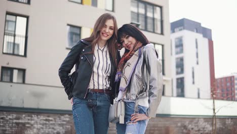 portrait-of-two-young-fashionable-girls-in-the-spring-city