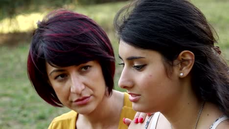 female-complicity:-girlfriends-chatting-at-the-park