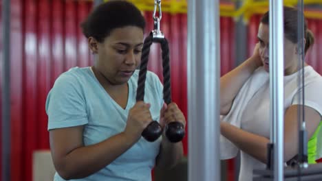 Woman-Giving-Advice-to-Friend-Training-in-Gym