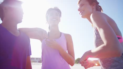 Multi-ethnic-people-enjoying-togetherness-on-beach-holiday