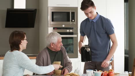 Friendly-Volunteer-Pouring-Tea-into-Cups