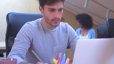 Man-and-woman-working-at-office