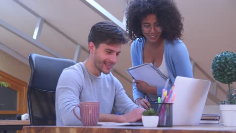 Mixed-race-business-partners-working-at-office