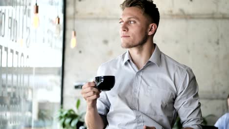 Businessman-holding-coffee-mug-and-drinking,-slow-motion.