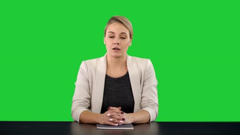 Young-beautiful-television-announcer-giving-a-speach-on-a-Green-Screen,-Chroma-Key