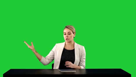 Television-anchorwoman-at-studio-pointing-to-sides-on-a-Green-Screen,-Chroma-Key