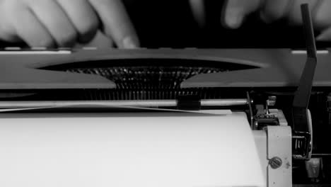 Male-hands-typing-on-a-typewriter