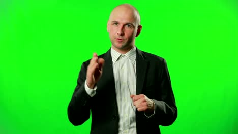 Businessman-presenting-something-in-the-studio-against-a-green-screen