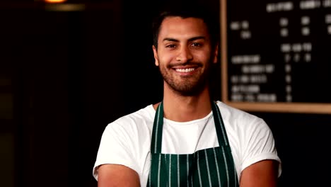 Handsome-waiter-smiling-at-camera