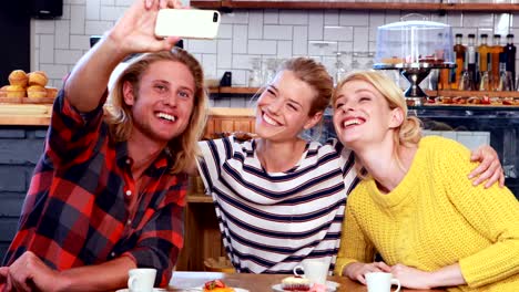 Smiling-friends-taking-a-selfie