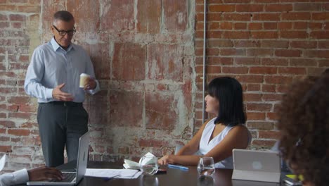 Group-Of-Businesspeople-Meeting-In-Boardroom-Shot-On-R3D