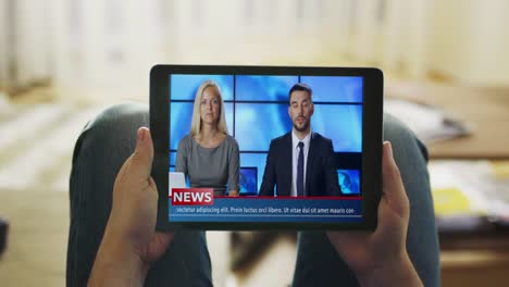 Relaxed-Man-Lying-on-His-Couch-Watches-News-Broadcast-on-His-Tablet-Computer.-Point-of-View-Shot.