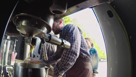 Male-Barista-Making-Coffee-Outside