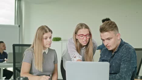 People-Group-Using-Laptop-in-Modern-Startup-Office