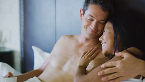 Couple-Enjoying-Breakfast-in-Bed