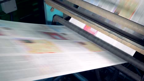 Printing-house-equipment.-Printing-machine-with-huge-amount-of-newspapers.