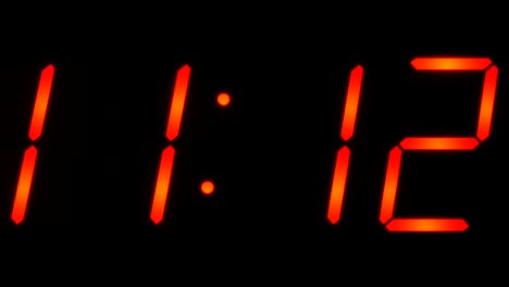 Time-showing-between-11:00-and-11:59-on-big-digital-clock