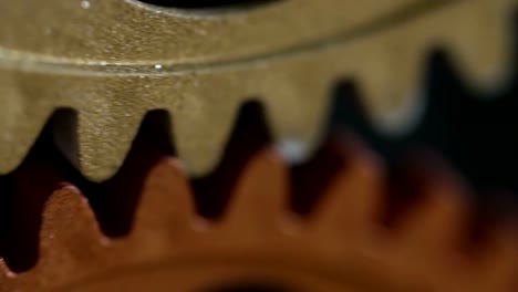 Clock's-wheels-marking-the-time,-running---close-up