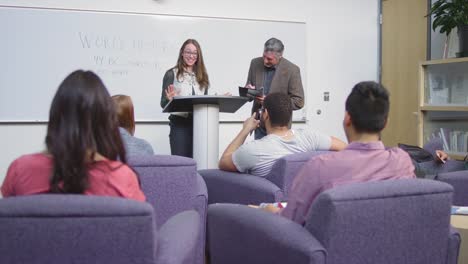 A-student-finishes-giving-her-speech-and-sits-down