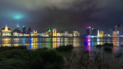 china-shanghai-nigh-light-cityscape-river-bay-custom-house-panorama-4k-tim-elapse