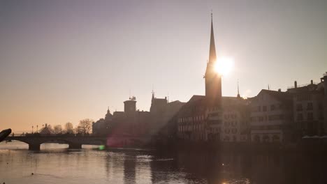 switzerland-sunset-sky-famous-zurich-river-lady-minster-cathedral-panorama-4k-time-lapse