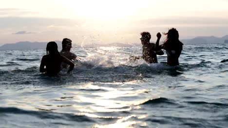 Cheerful-People-Group-In-Sea-Splashing,-Young-Group-Of-Friends-Having-Fun-During-Vacation-On-Beach