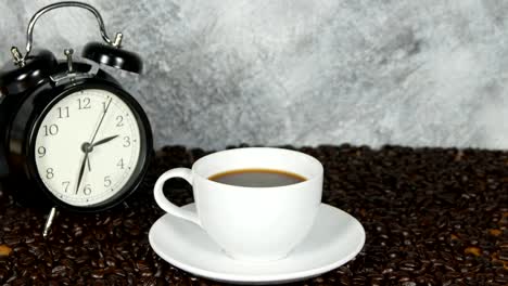 panning-shot-of-coffee-cup-on-coffee-beans-background