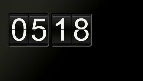 Flip-clock-animation-counting-from-00:00-to-23:59-with-white-numbers-on-black-background